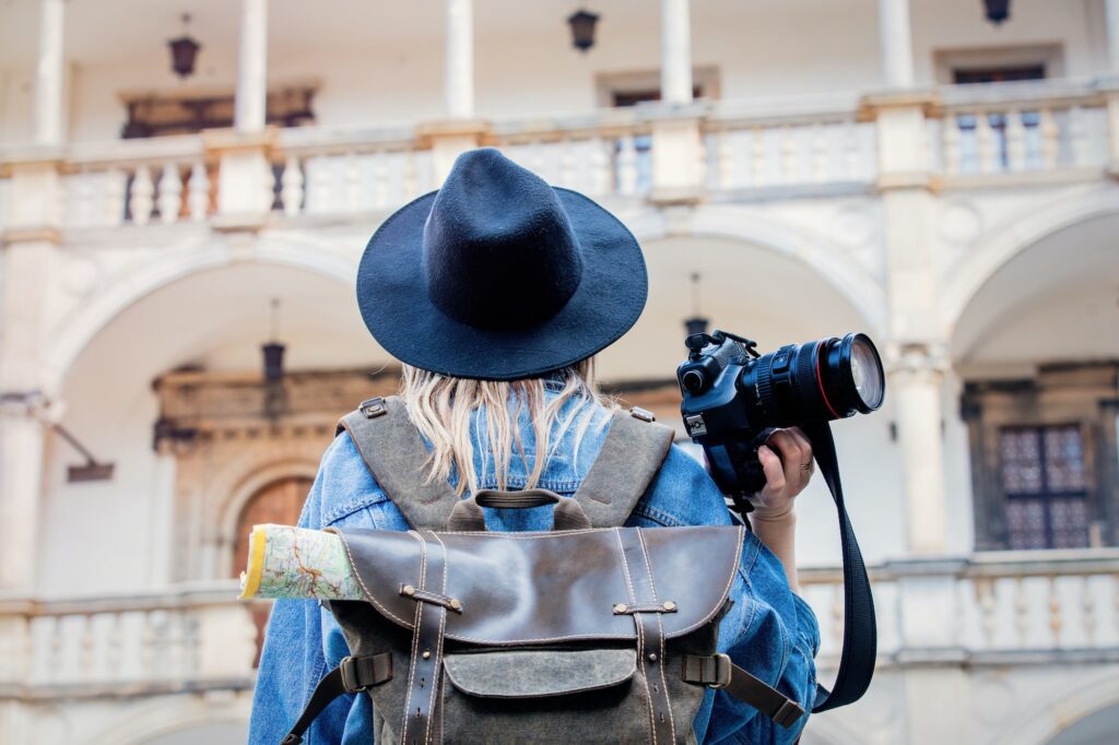 Young woman, professional photographer with camera